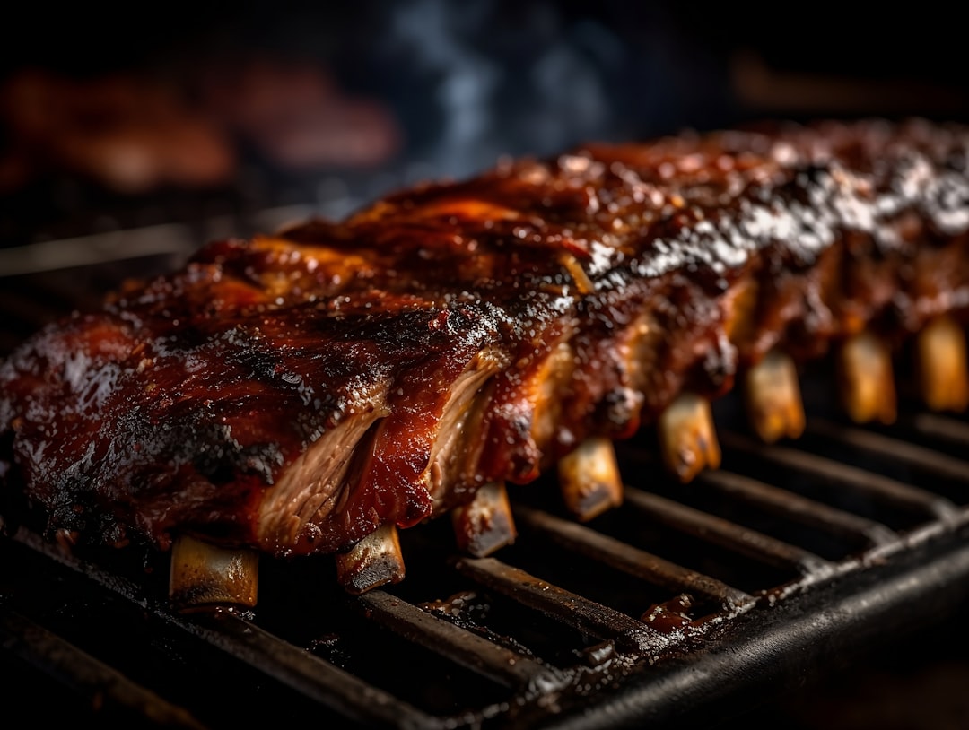 BBQ grill with perfectly grilled meat and ribs showing char marks