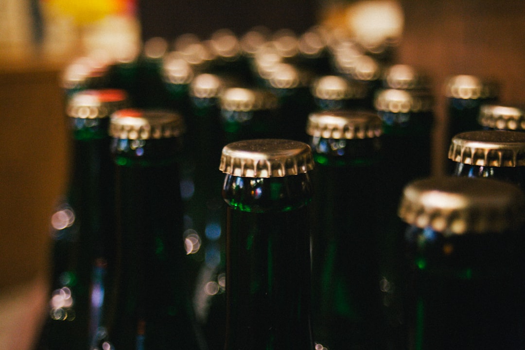 Diverse collection of craft beer bottles and cans showcasing different styles